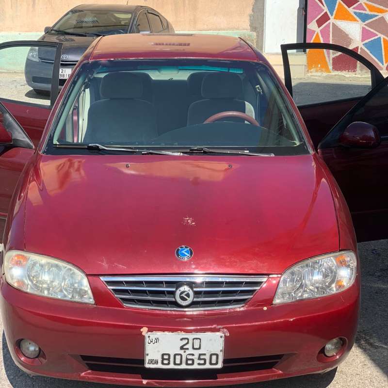 كيا سبكترا لون احمر اتوماتيك فحص ممتاز ليست بحاجة إلى أي شيء موديل 2003 مرخصة لغايه شهر 12