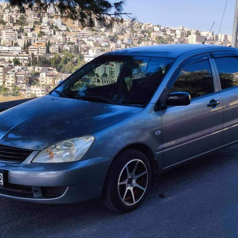 لانسر 2013 ماتور 1300 اتوماتيك معها ترخيص ل 23-8-2025
