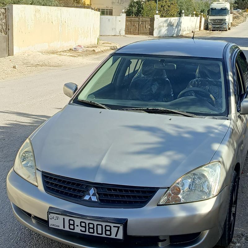 لانسر 2010 ماتور 1300فحص 3 جيد ماتور و