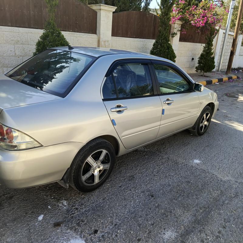 لانسر 2010 ماتور 1300فحص 3 جيد ماتور و